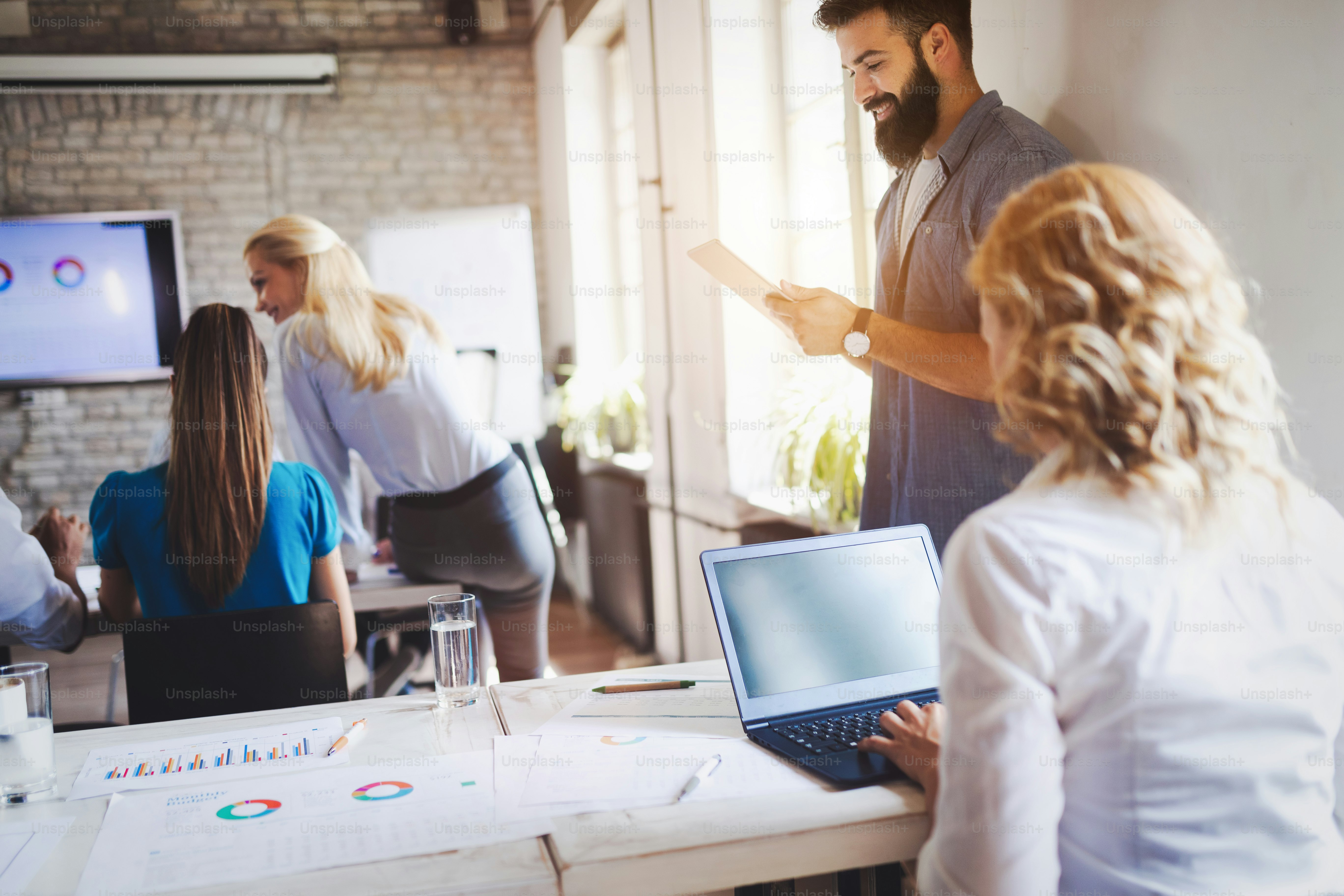 Successful happy group of students learning software engineering and business during presentation