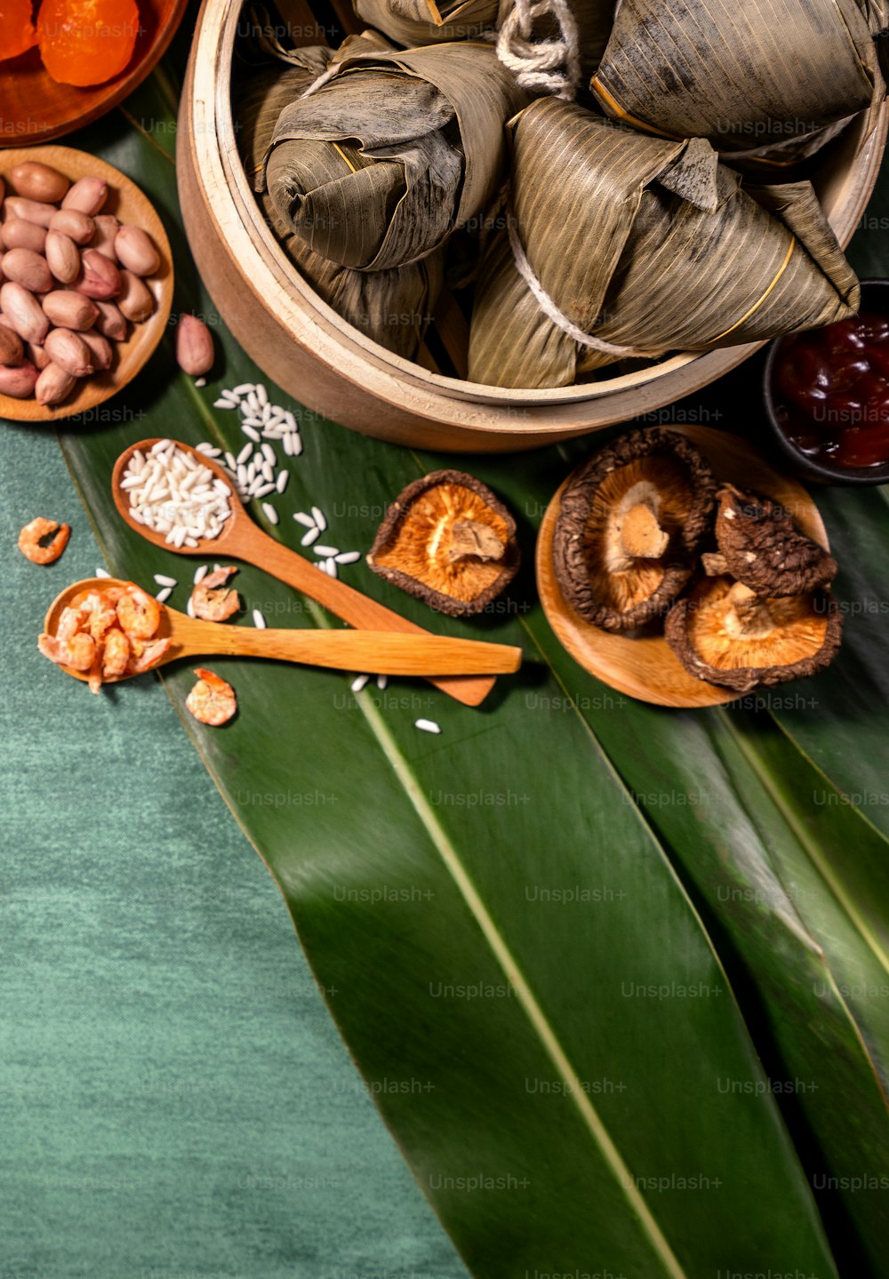 Close up, copy space, top view, flat lay. Famous asian chinese tasty handmade food in duan wu festival, steamed rice dumplings shaped like pyramidal ingredients