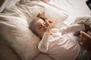 Good morning. Mother and daughter in bed.