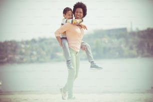 Enjoying beach moments. Mother and son on the beach