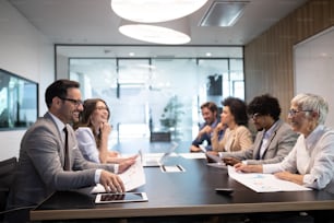 Business colleagues having meeting in conference room in modern office