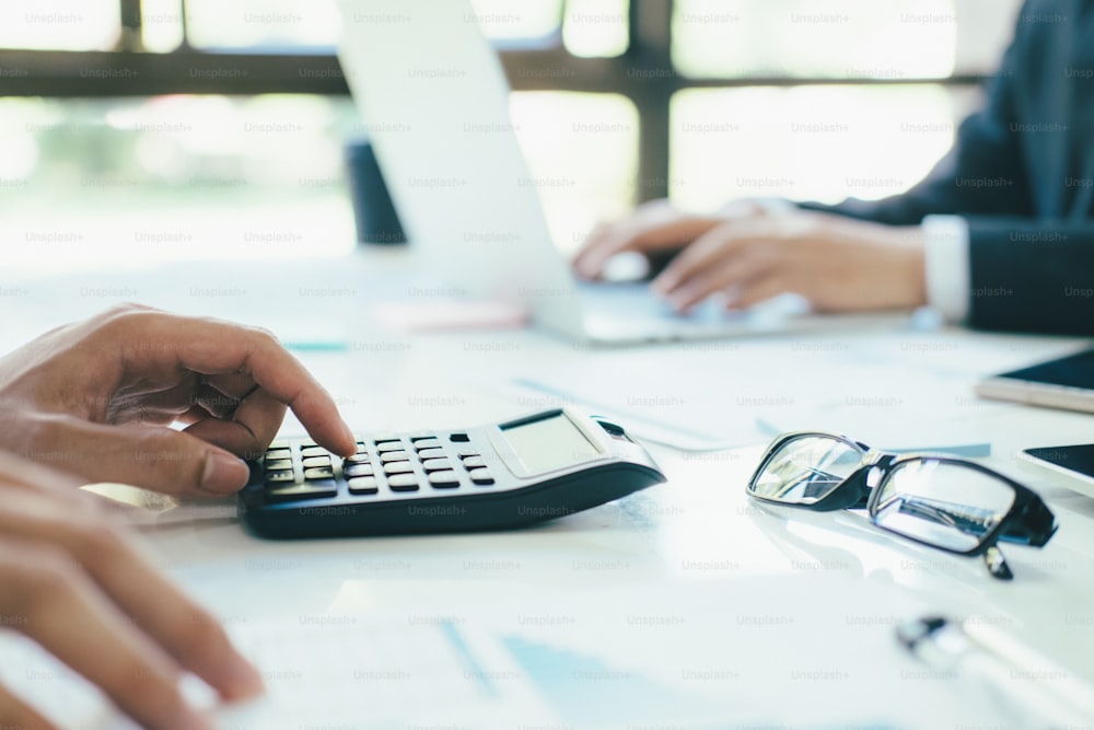 Finances Saving Economy concept. Accountant or banker use calculator.