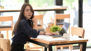 Successful Asian confident business woman working at the co working space