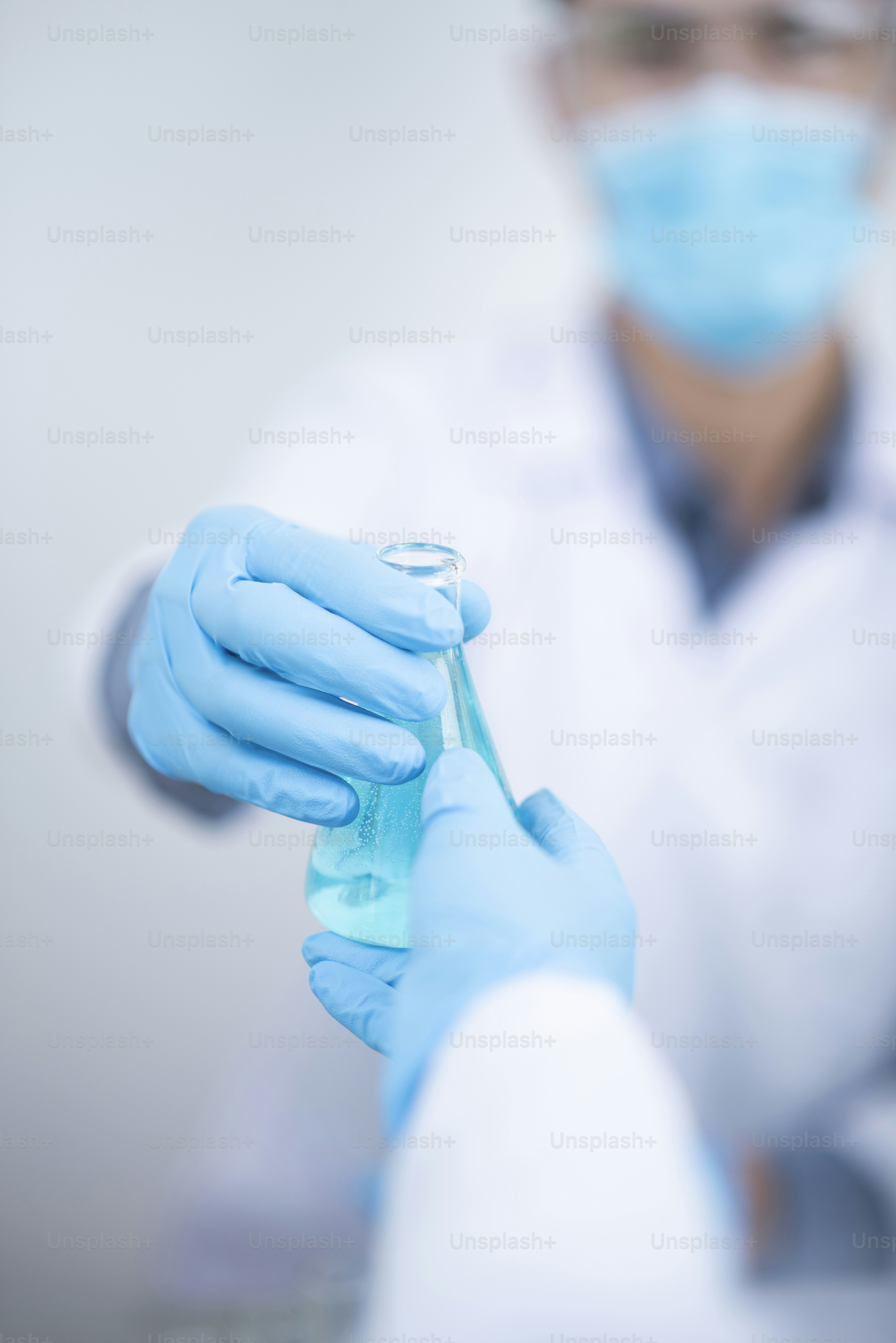 Health care researchers working in life science laboratory. Young research scientist preparing and analyzing microscope slides in research lab
