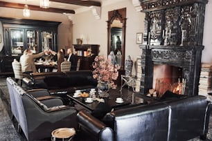 Nice interior. Family friends having nice time in beautiful luxury modern restaurant.