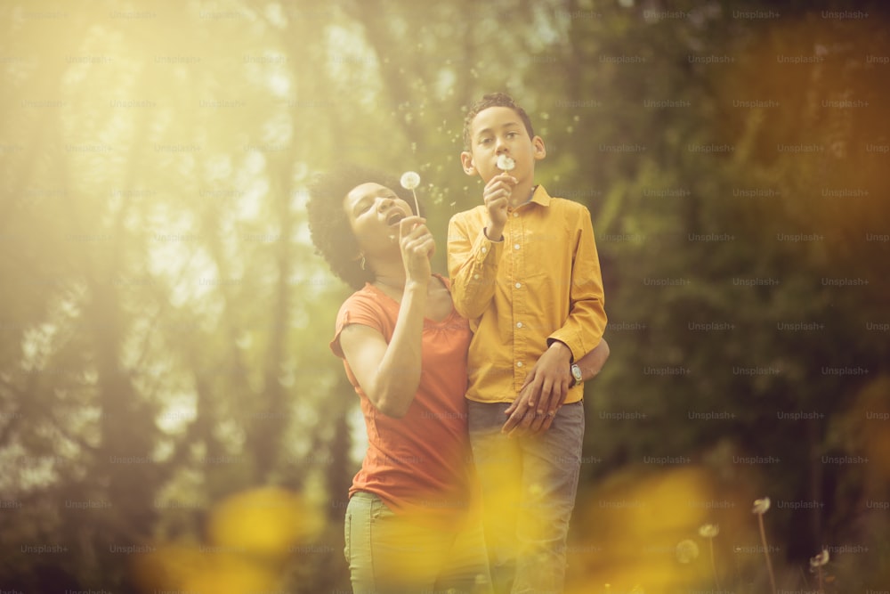 Fun and whimsy in the fields. Mother and son in the park.