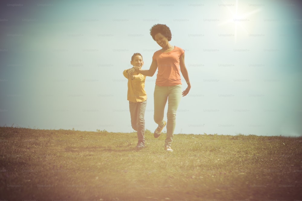 Mother-son time is priceless. Mother and son in the park.