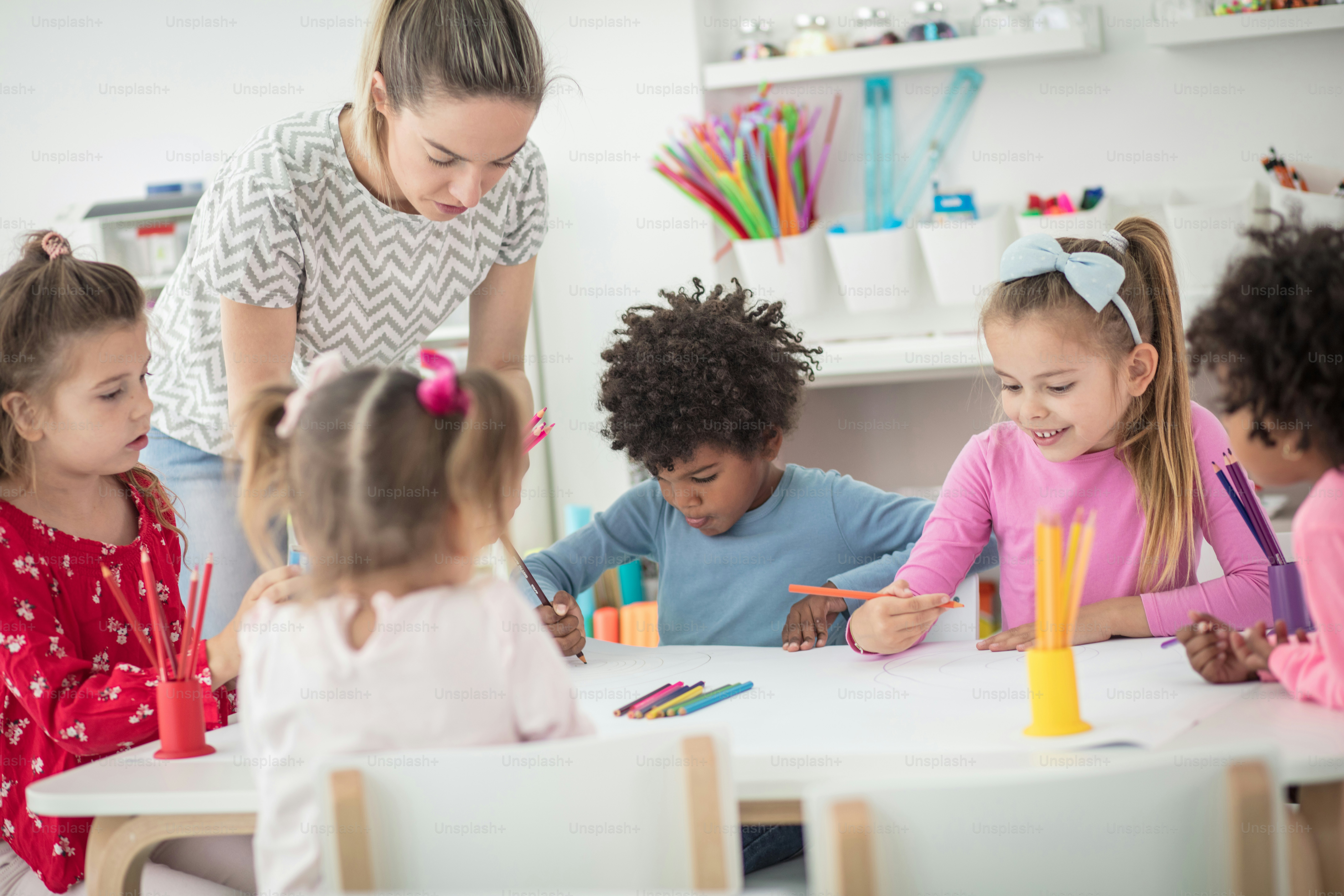 Teacher knows how to turn learning into a fun experience. Children in ...
