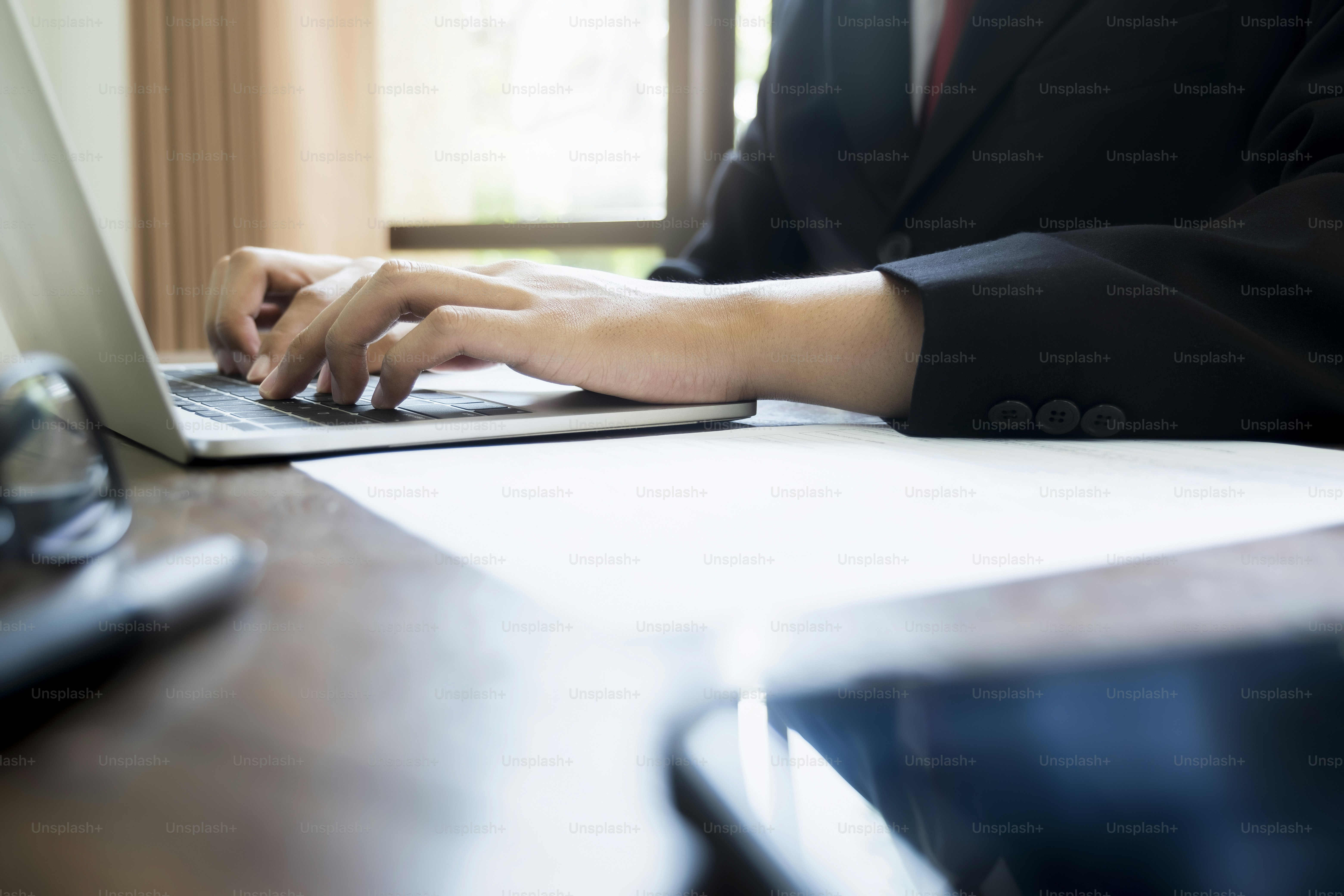 Businessman using computer to planning and analyse investment marketing data.