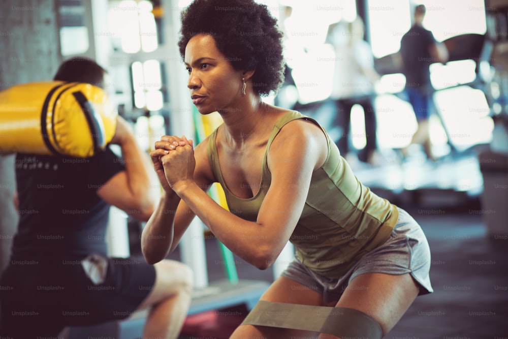 Good muscle. Woman at gym.