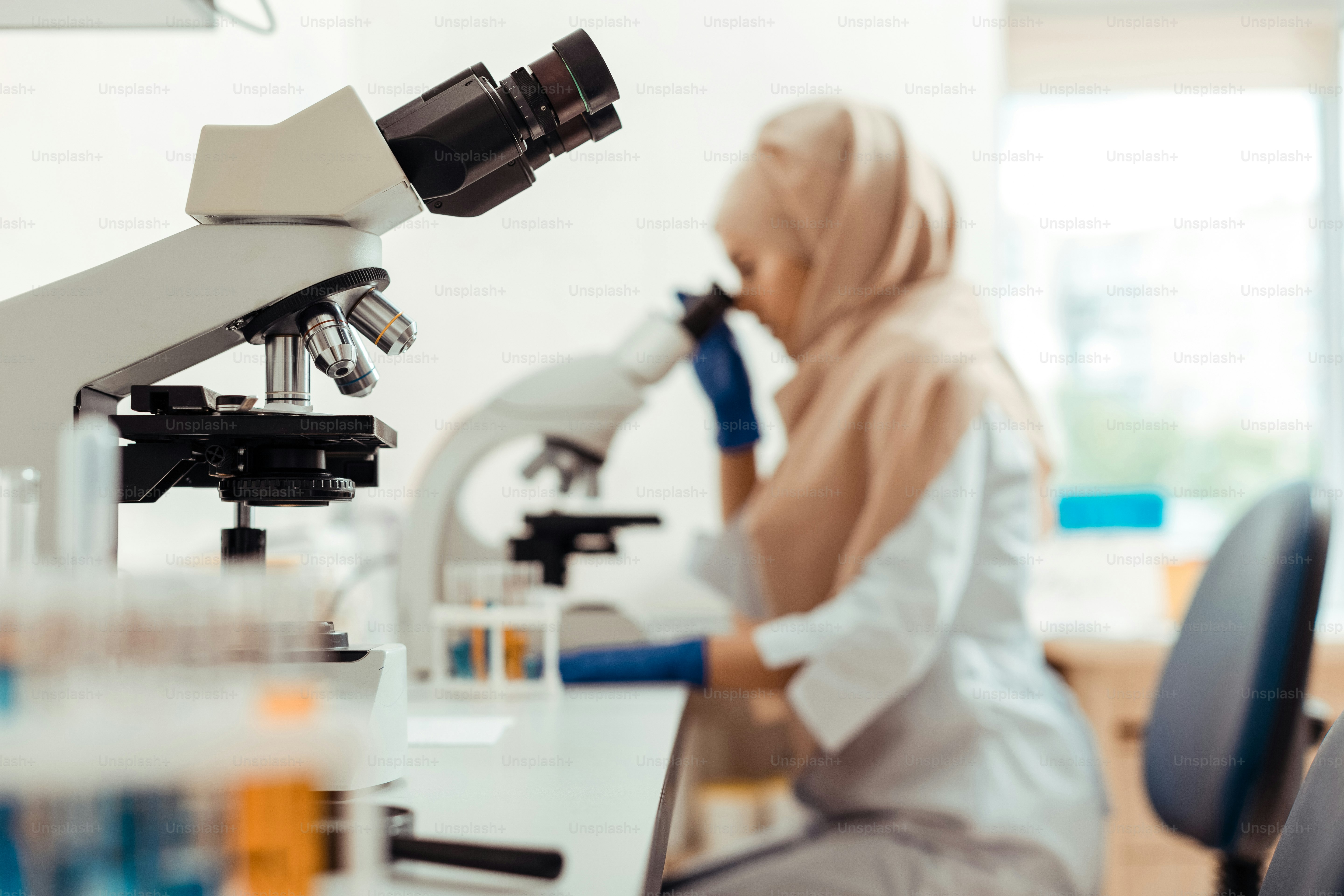 Professional equipment. Selective focus of a modern professional microscope standing on the table