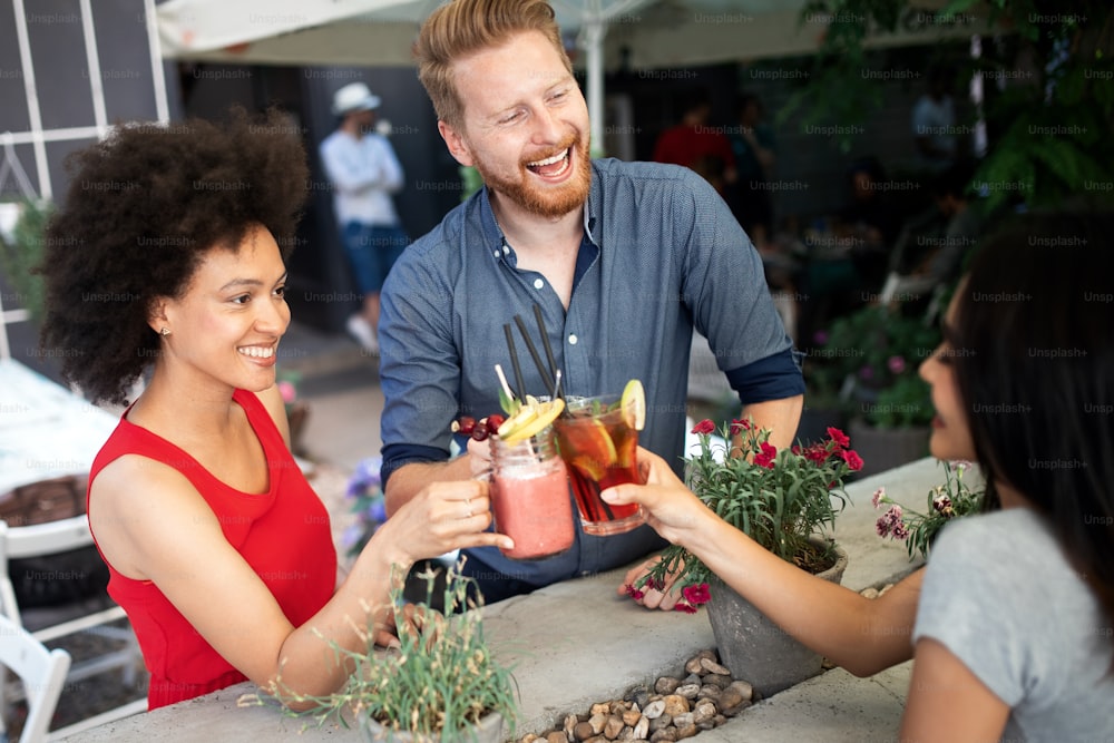 Multiracial group of friends having fun and talking together