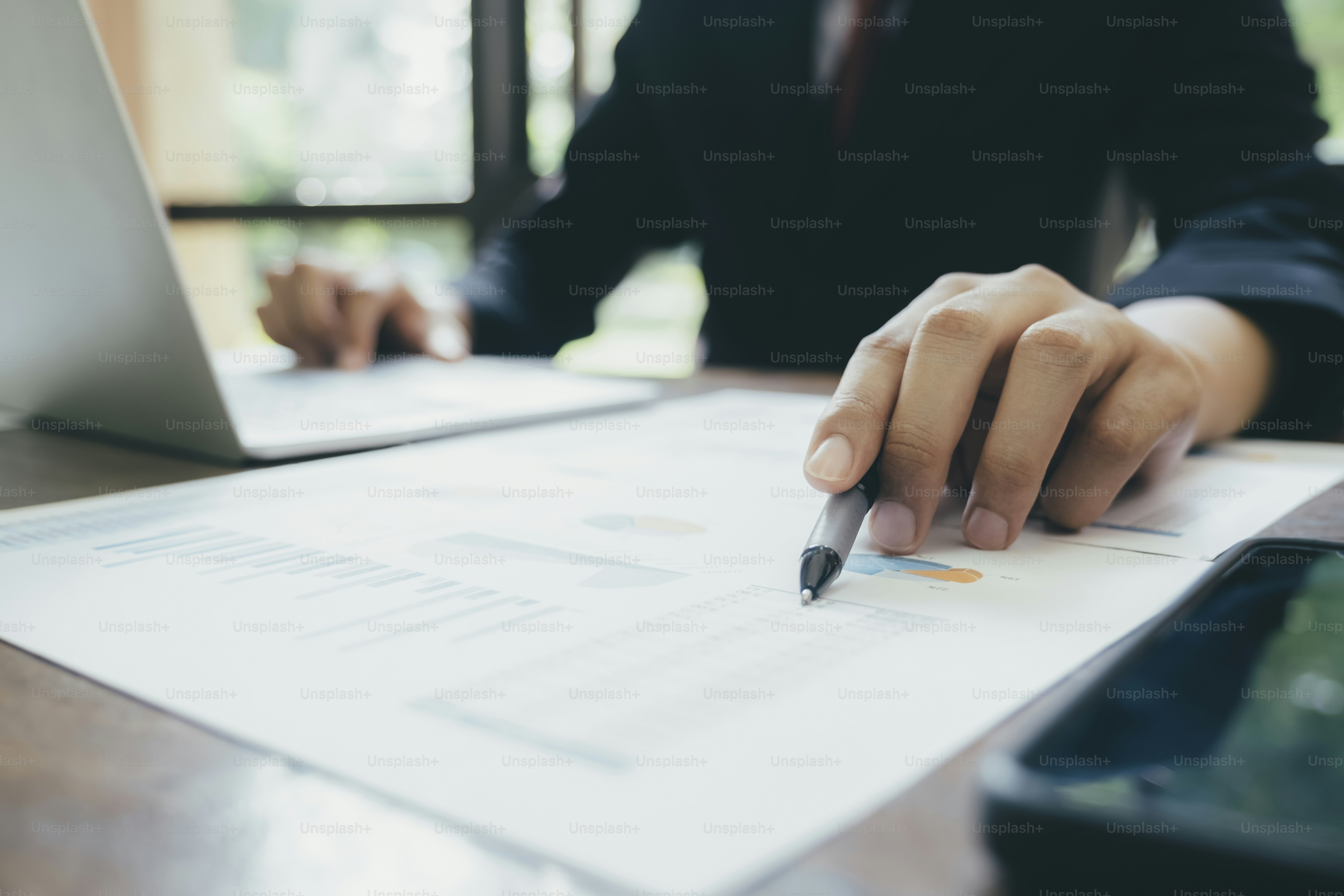 Businessman planning and analyse investment marketing data.