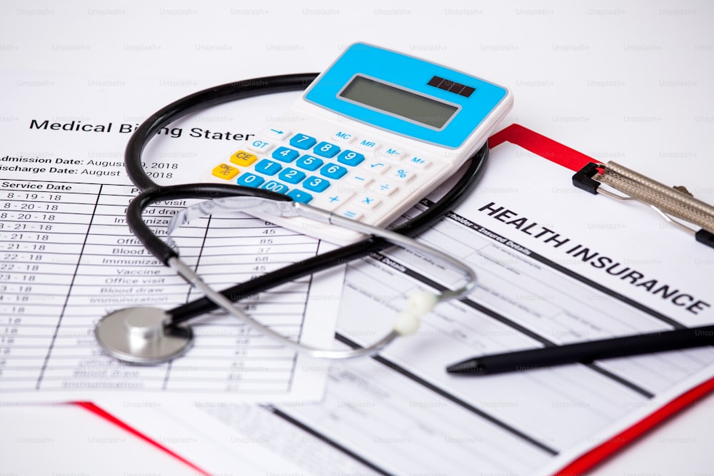 Health care costs. Stethoscope and calculator symbol for health care costs or medical insurance.