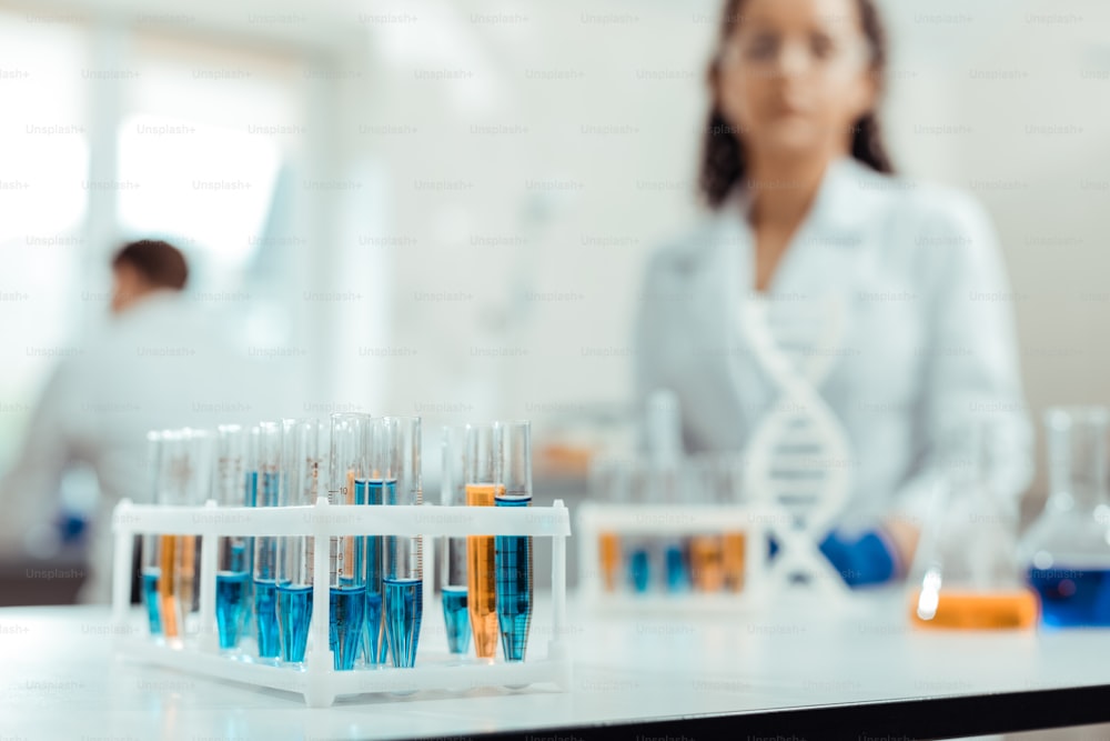 New treatment. Selective focus of test tubes with vaccine samples standing on the table