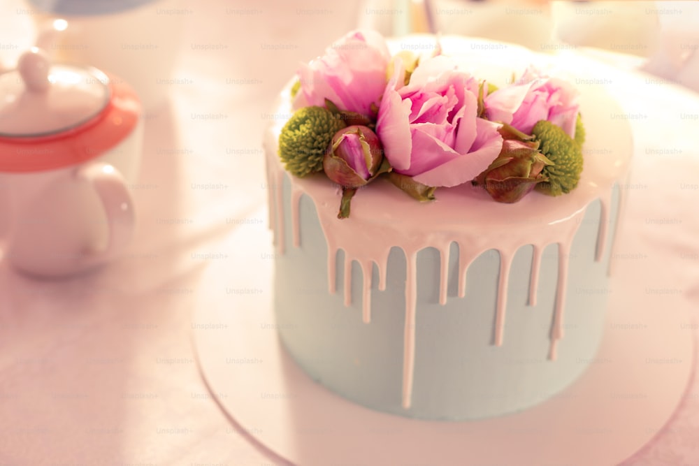 Colorful wedding cake. Close up of amazing delicious colorful wedding cake standing on the table
