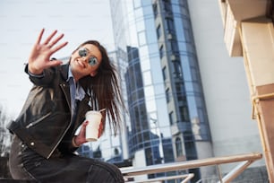 Leather jacket. Young beautiful girl in warm clothes have walk in the city at her weekends time.