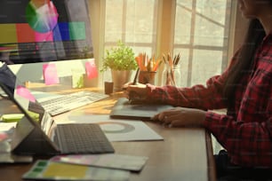 Graphic designer Woman working with digital pen and tablet on creative workspace, Vintage tone.