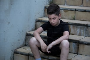 Portrait of a sad teenage boy looking thoughtful about troubles. Pensive teen. Depression, teen depression, pain, suffering