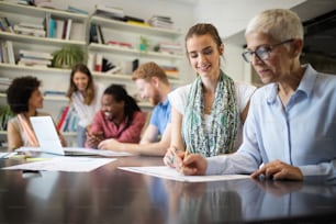 Group of business people collaborating on project in modern office