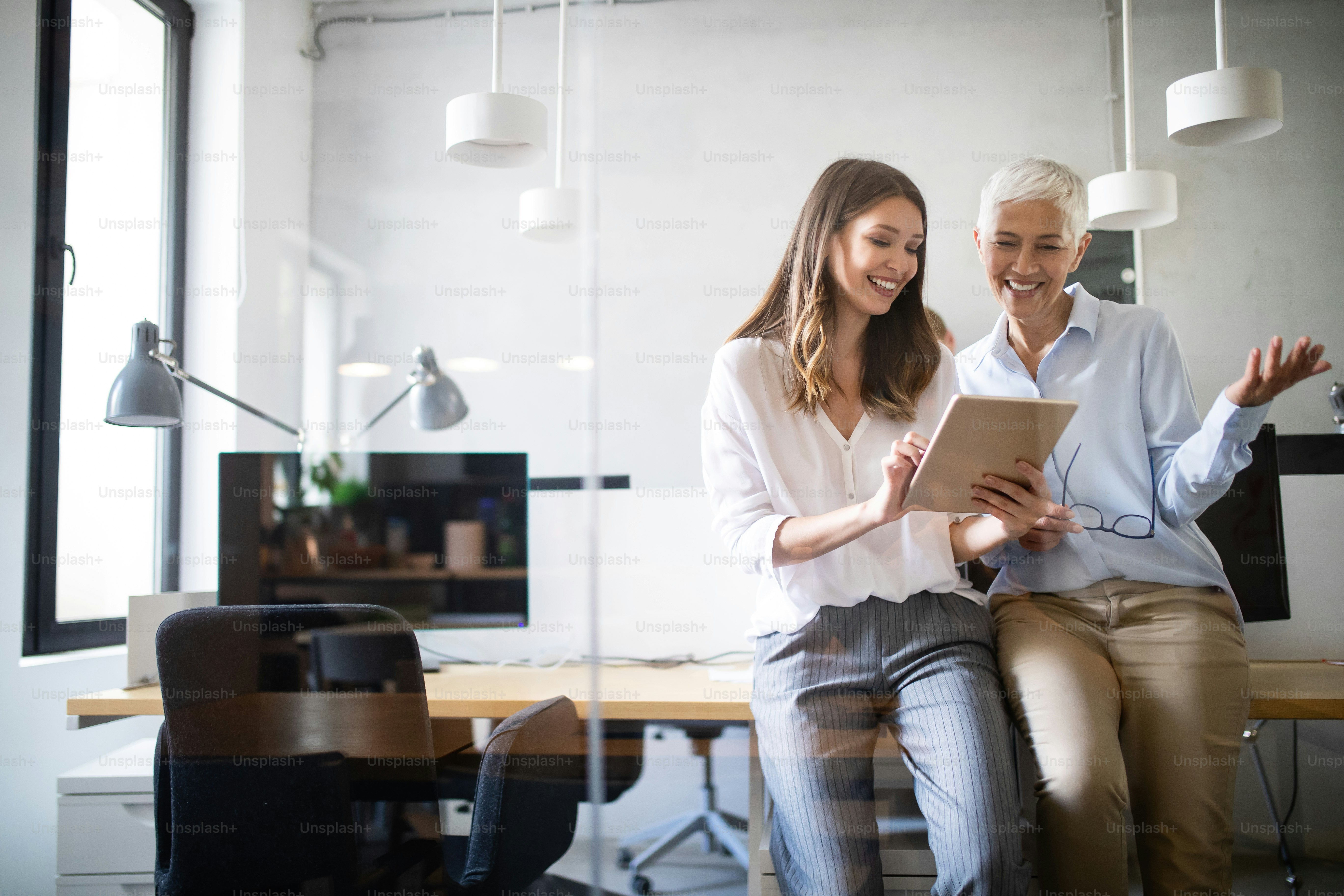 Collaboration and analysis by business people working in modern office