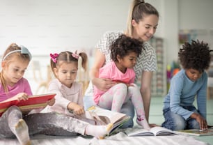 They loves books. Children in preschool reading books.