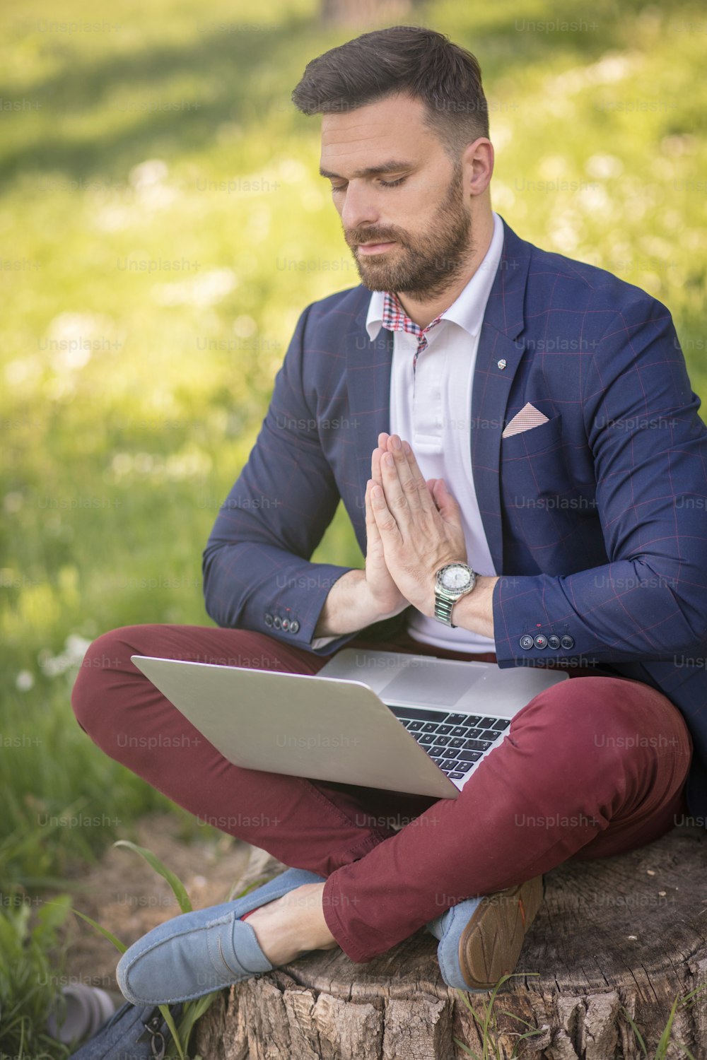 Connected with nature and job.  Business man working yoga.