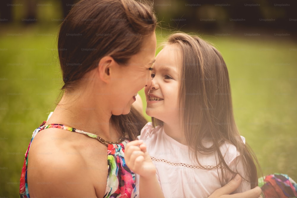 Strong love between mother and daughter. Mother and daughter in nature.