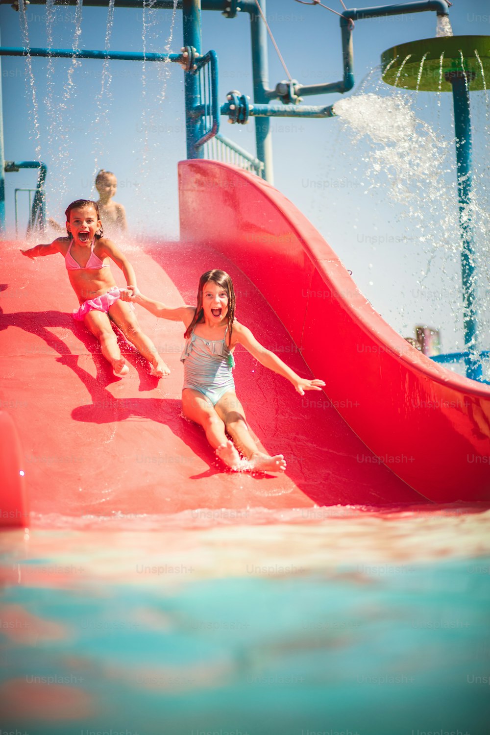 Summer best vibes. Children having fun on toboggan.