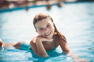 The most beautiful seasons, pool sun water. Child in water.
