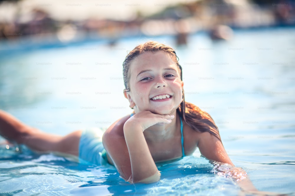 Princess of the pool. Child in water.