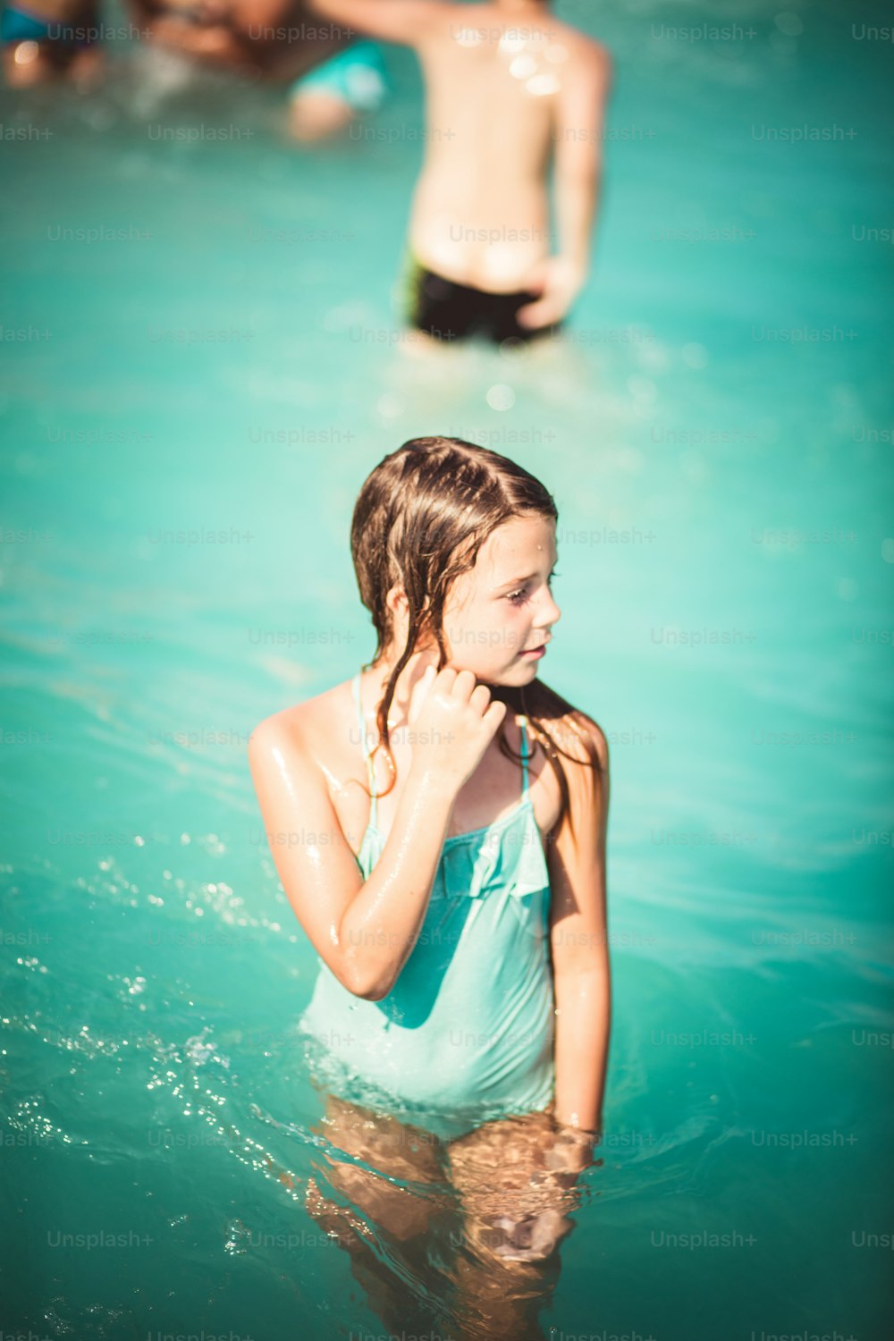 The best days are summer days. Child in water.