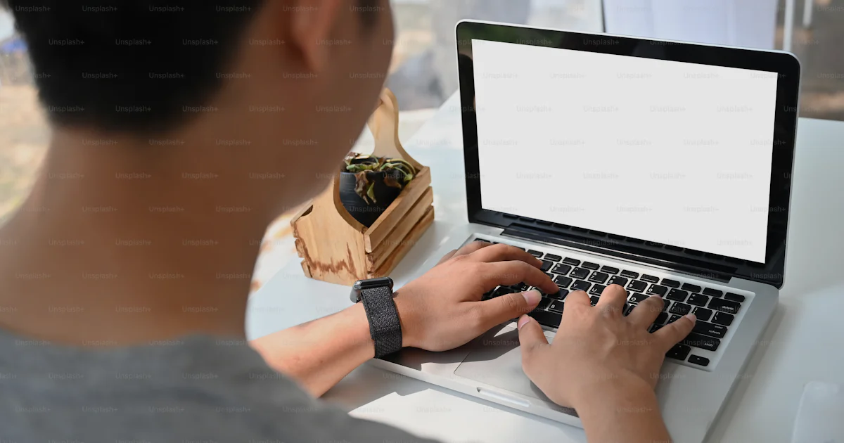 Unsplash Main Using Computer Man using mockup laptop computer with empty screen. photo – Computer ...