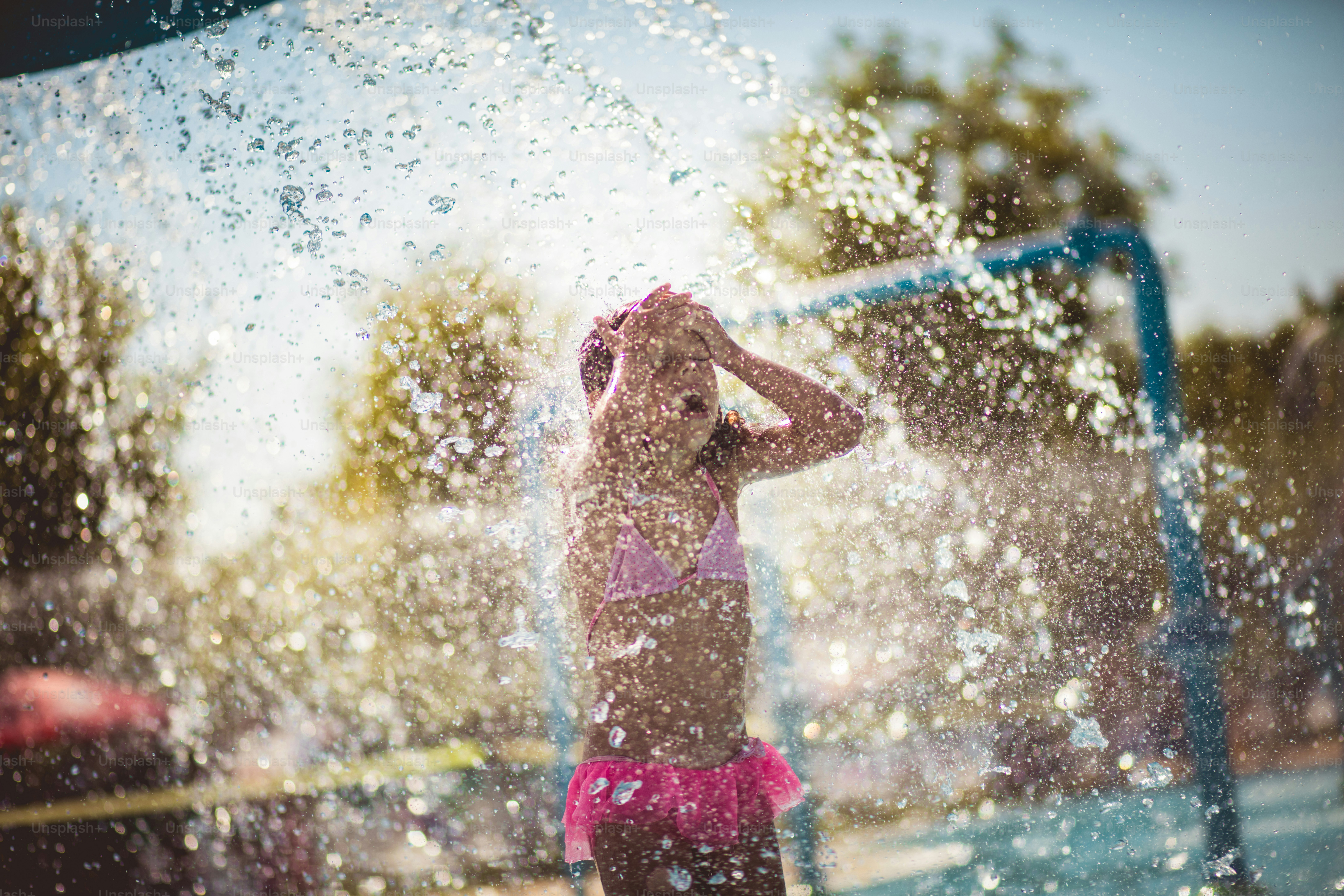 Fun with water. Child having fun in the pool.