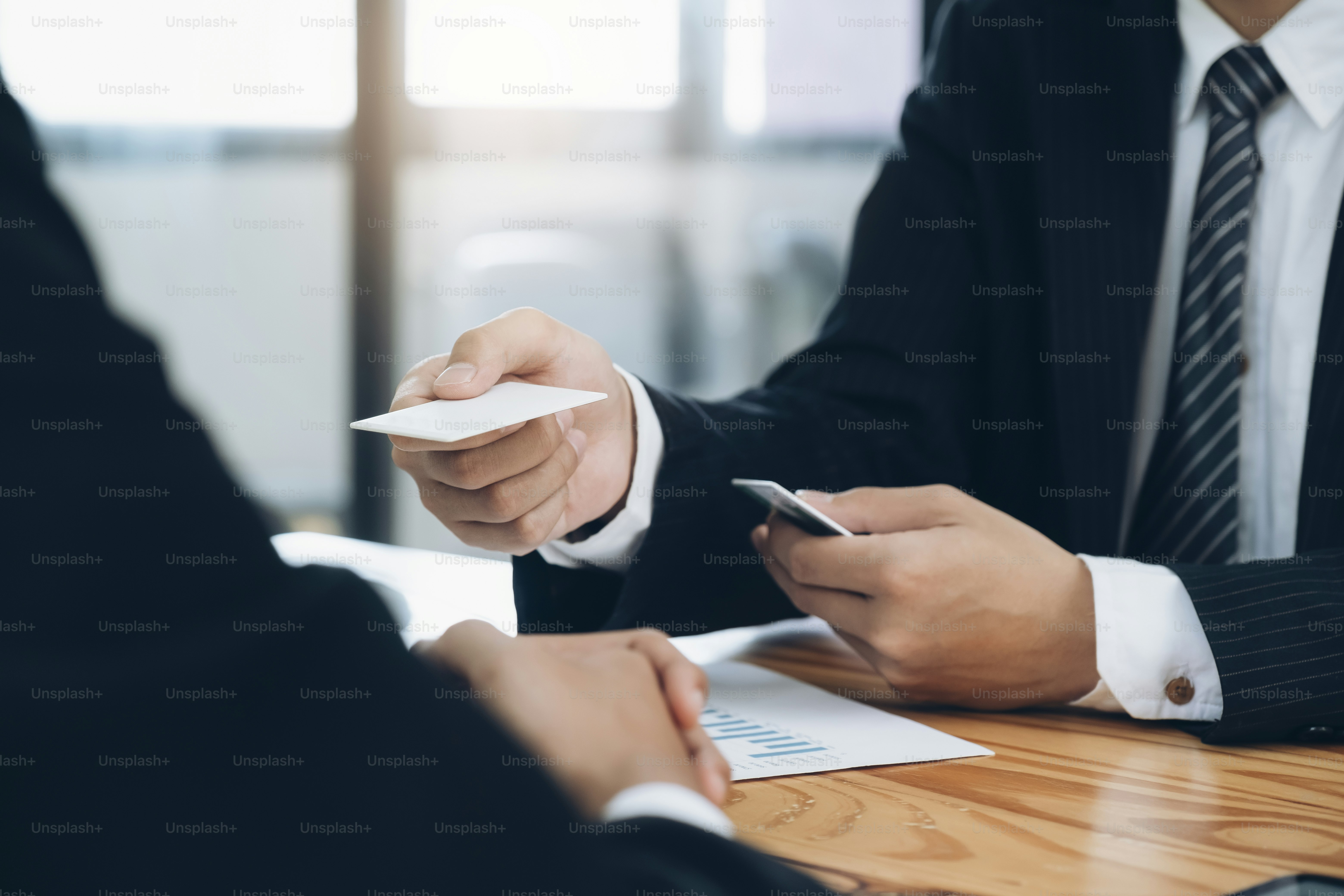 Businessman giving a business card. Business partners and colleague.