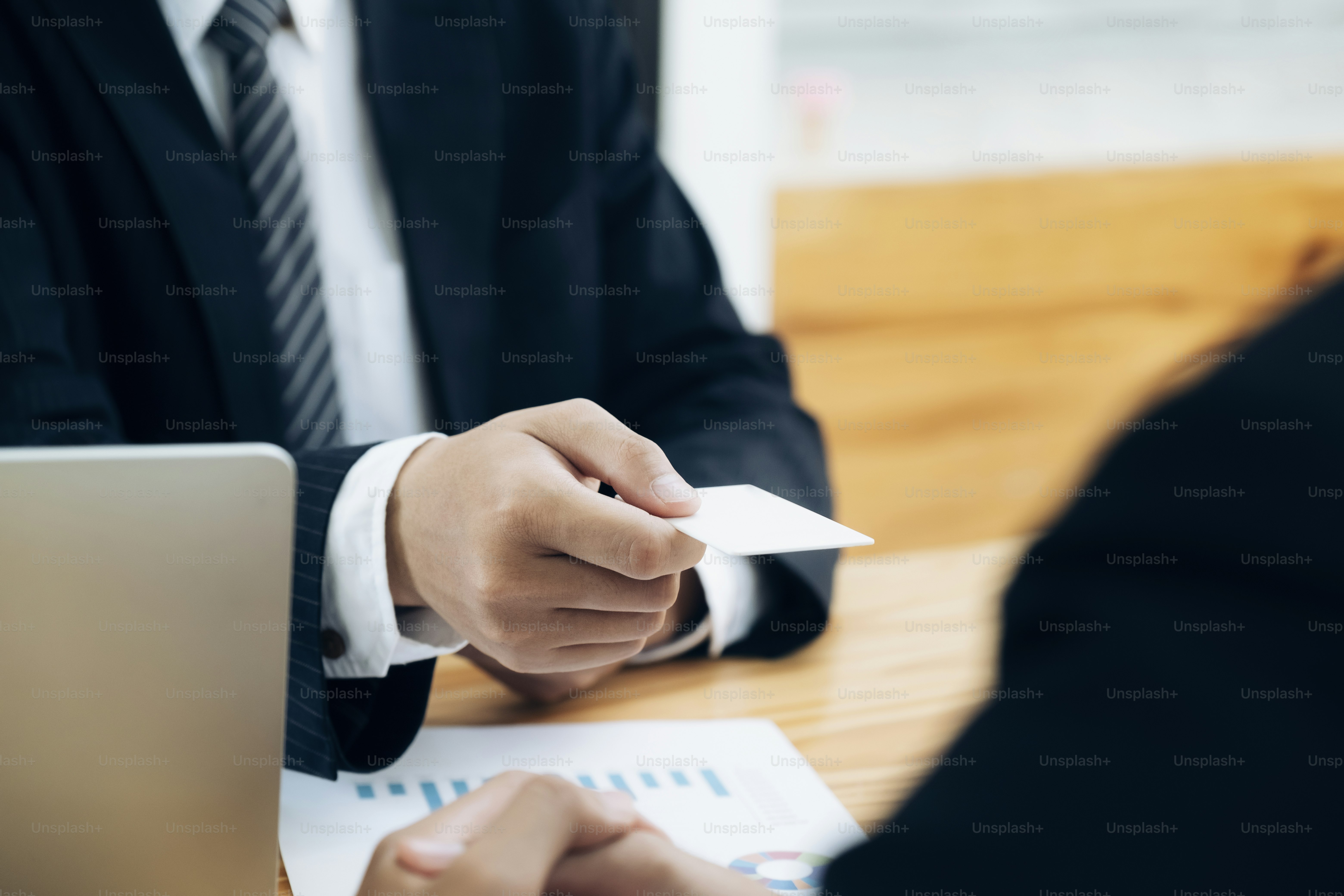 Businessman giving a business card. Business partners and colleague.