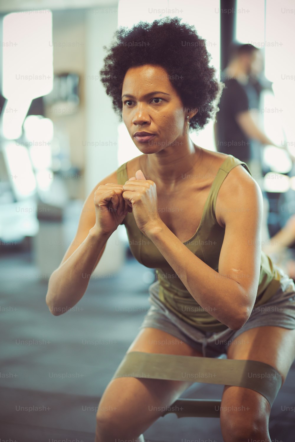 Loving your workouts. Woman in gym.