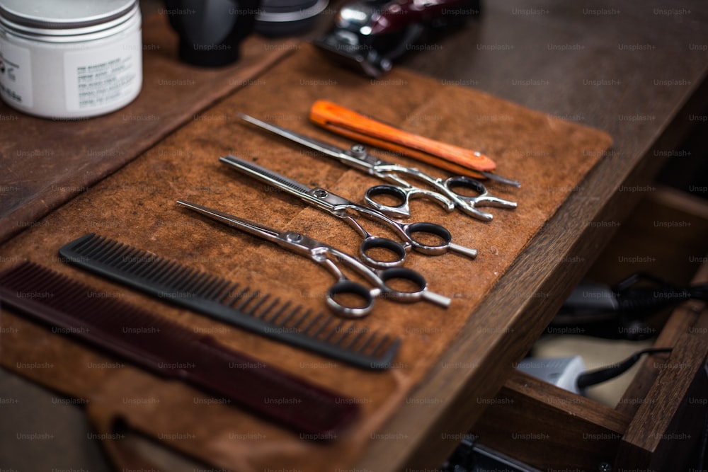 Barber shop tools on old wooden background.