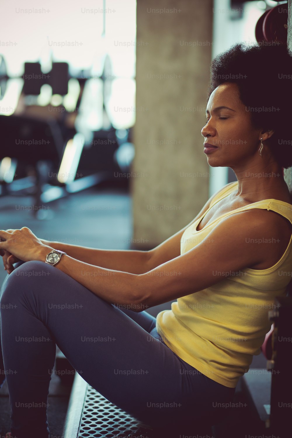 Nothing feels better than the feeling after a workout. Woman at gym.