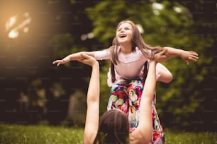 Free as can be. Mother and daughter in nature.