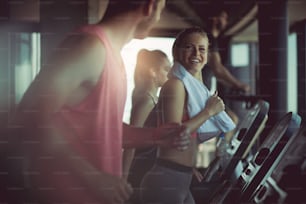 Having a gym buddy makes exercising more fun. People at gym.