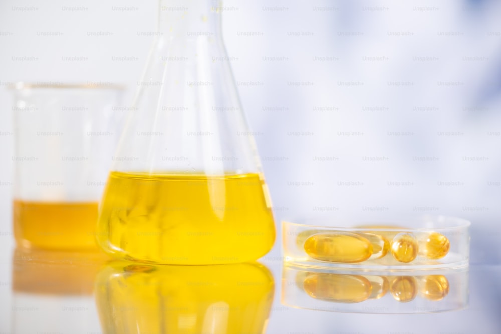 The scientist test the natural product extract, oil and biofuel solution, in the chemistry laboratory.