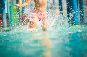 Legs know the way to fun. Child having fun in pool.