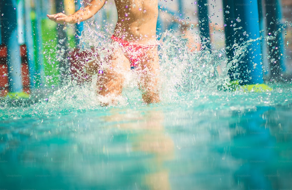 Legs know the way to fun. Child having fun in pool.