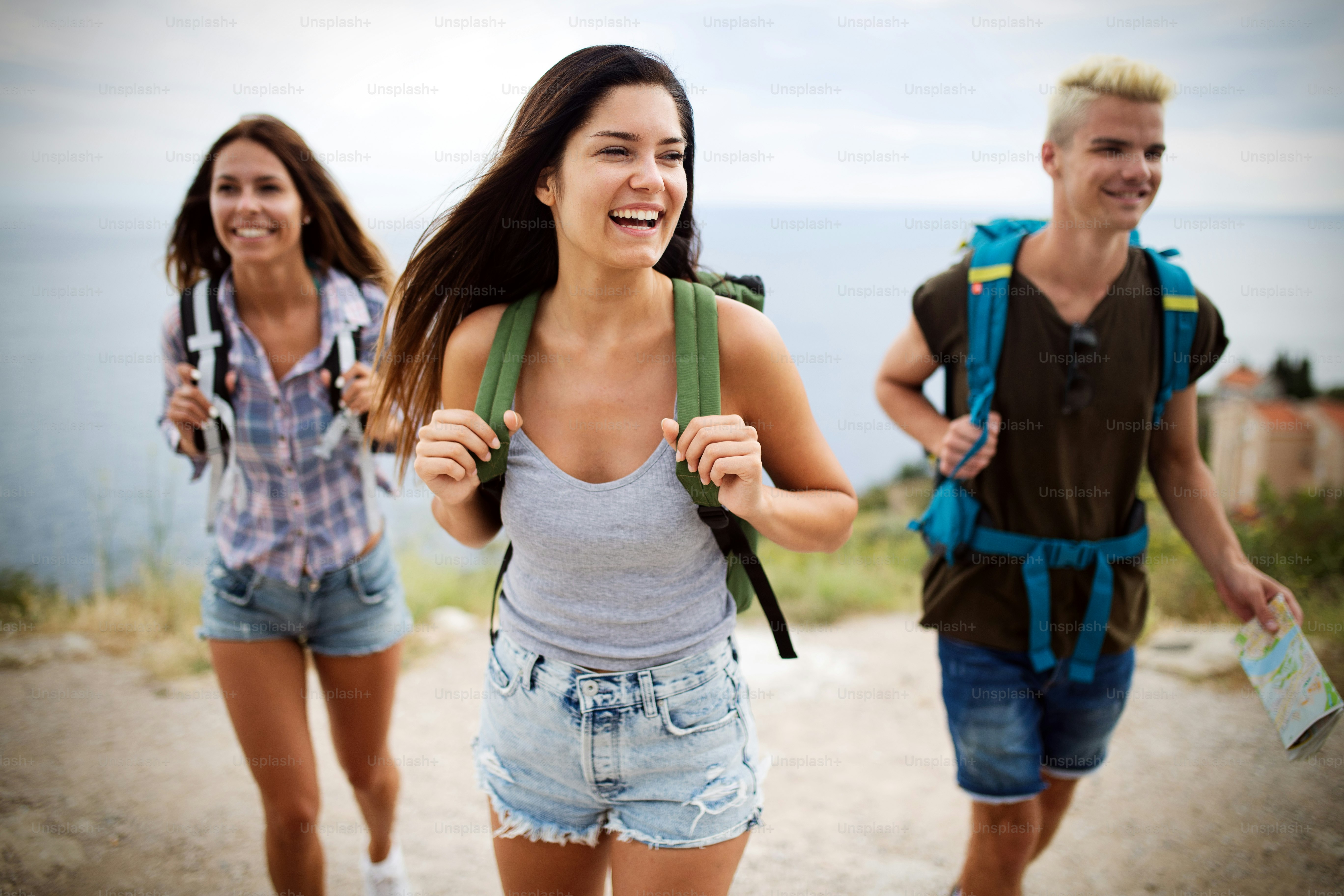 Happy hipster company of friends traveling around world, having fun ...
