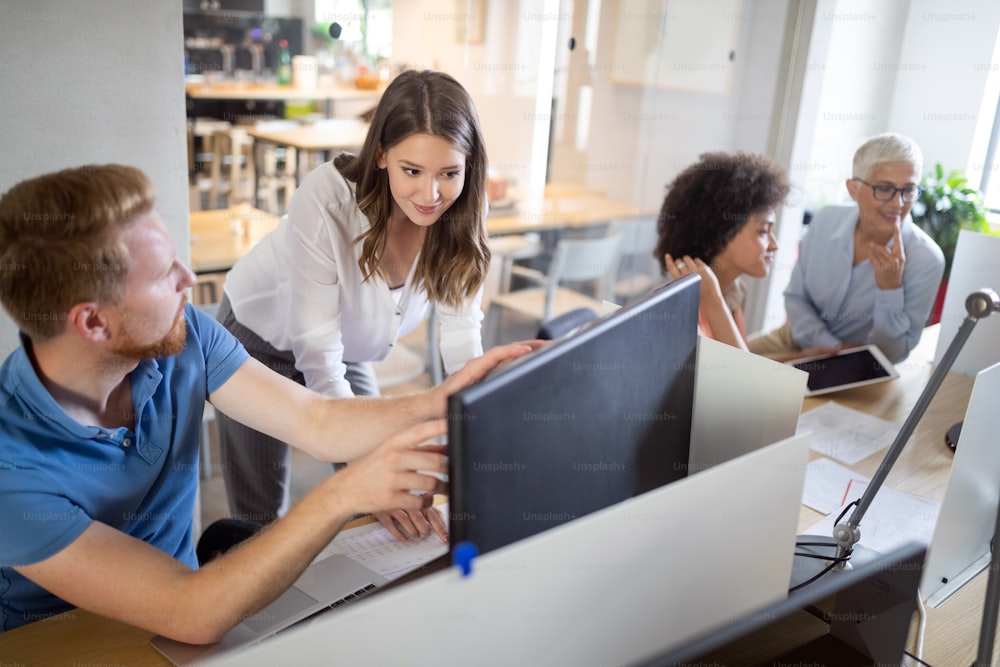 Programmers working in a software developing company office