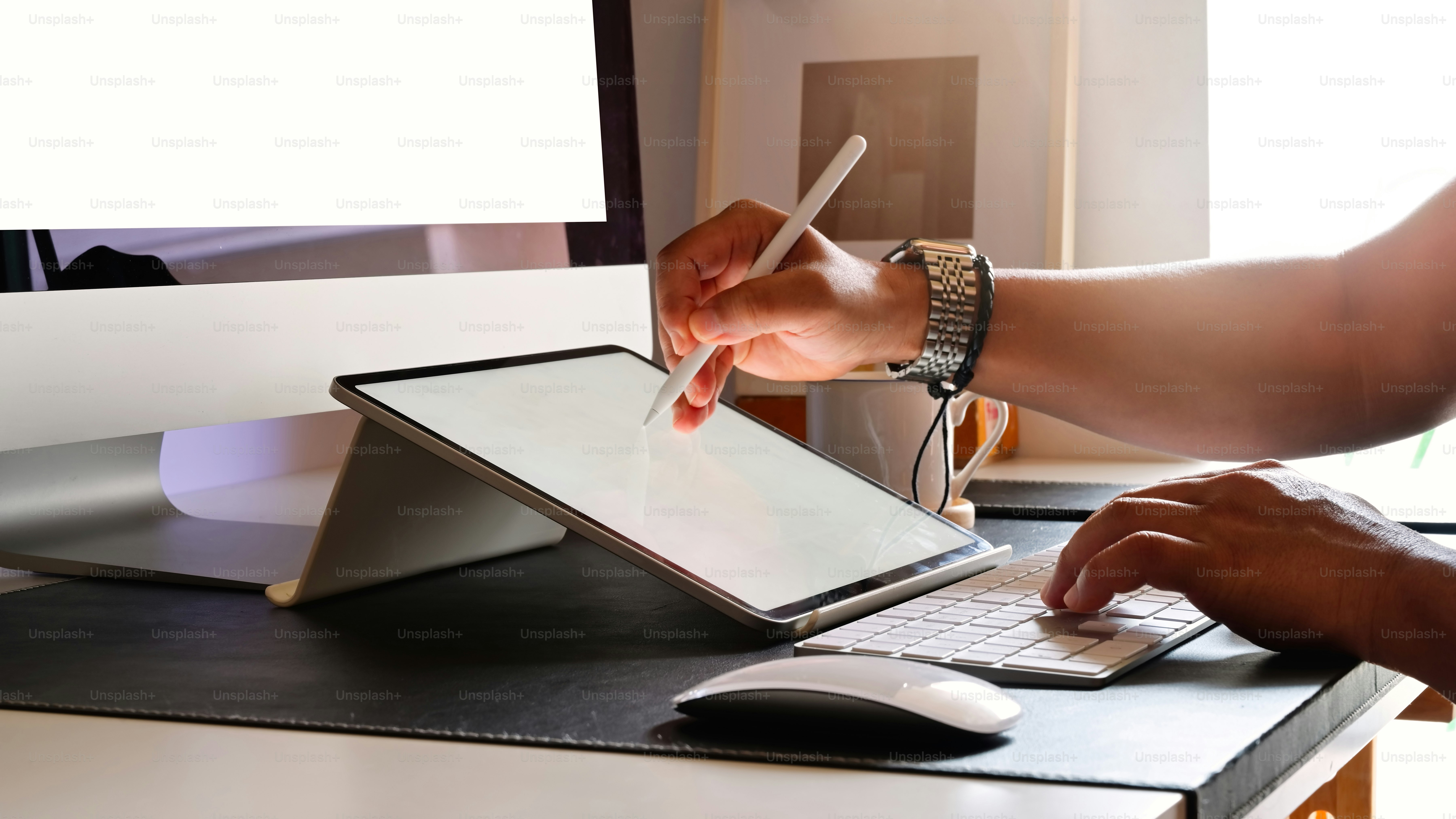 Cropped shot of young designer drawing sketches on graphic tablet in studio
