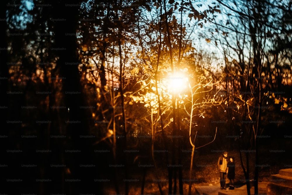 happy stylish couple hugging and holding hands with tender under yellow lantern  in night lights of the city