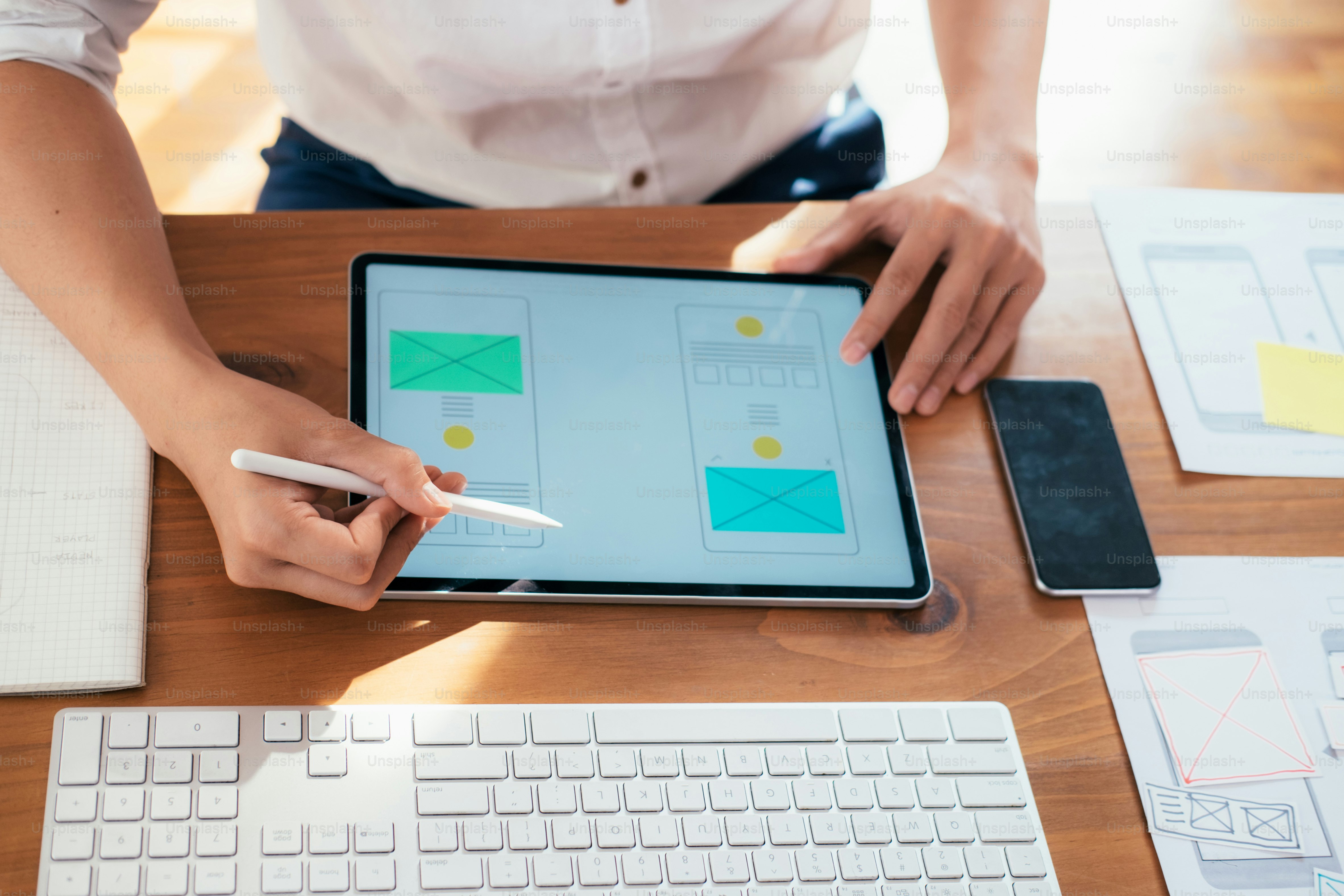 Web designer, UX UI designer designing mobile application user interface. Creative planning application development sketch layout wireframe design