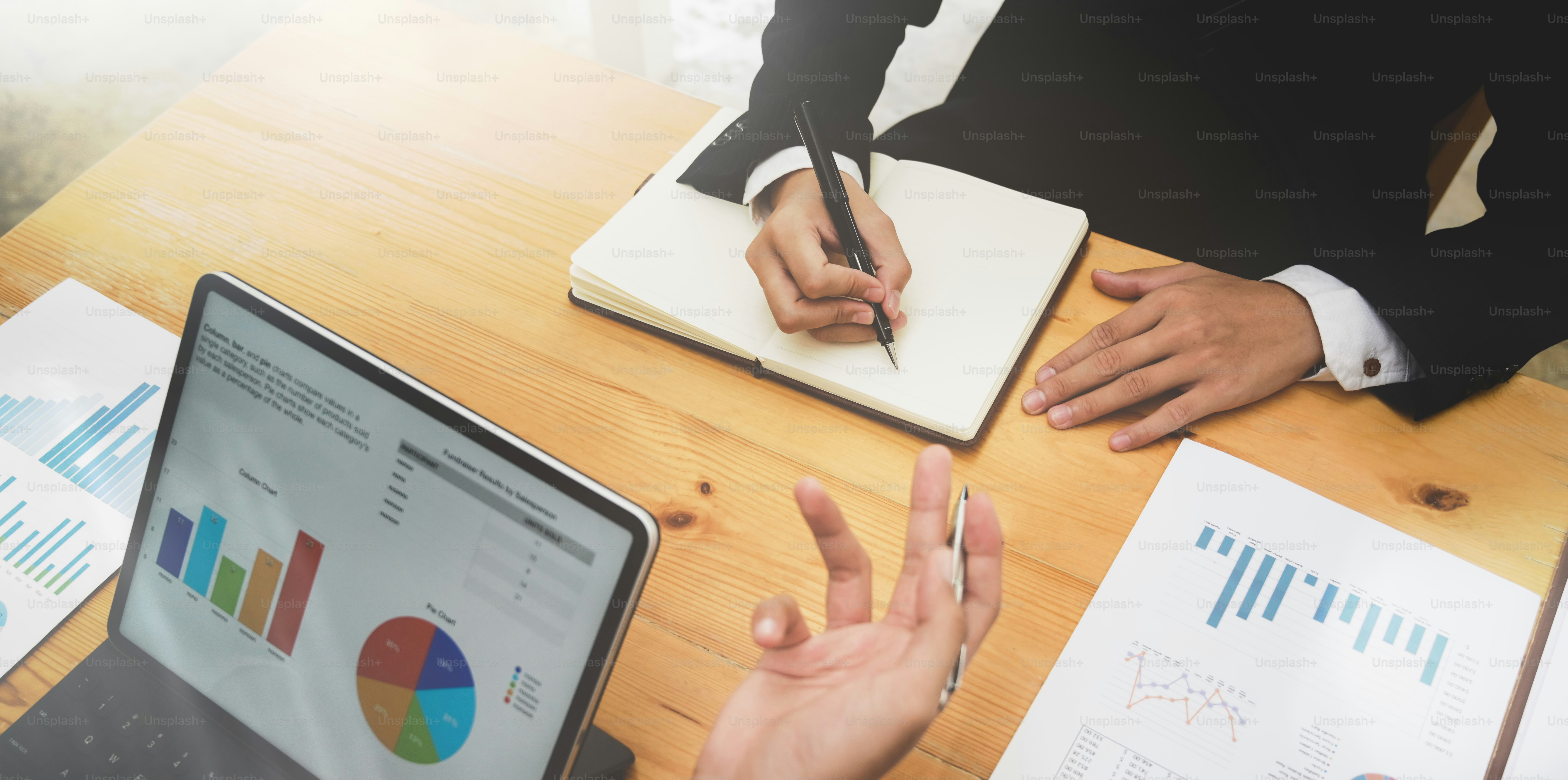Business partner brainstorming the investment plan together in office room